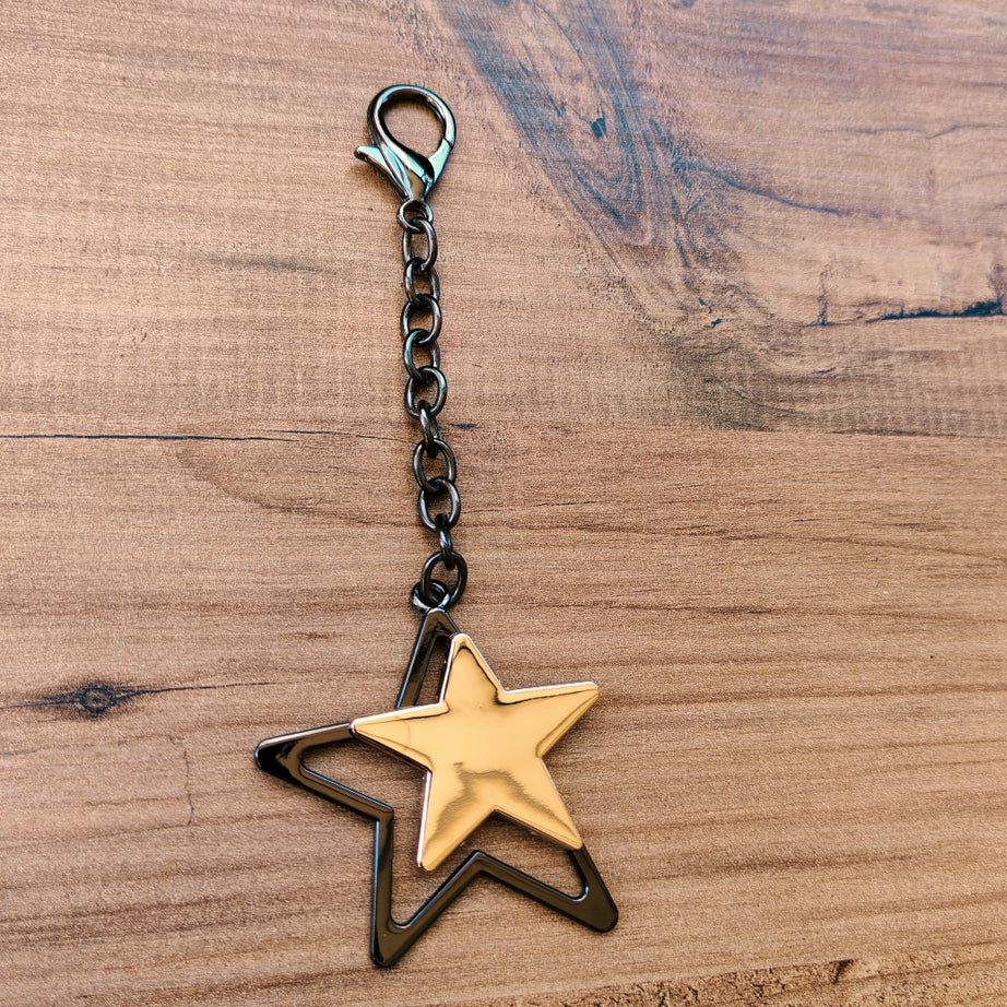 Altın ve Siyah İç İçe Yıldız Çanta Süsü