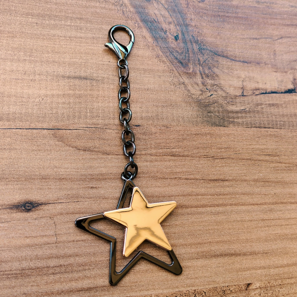 Altın ve Siyah İç İçe Yıldız Çanta Süsü